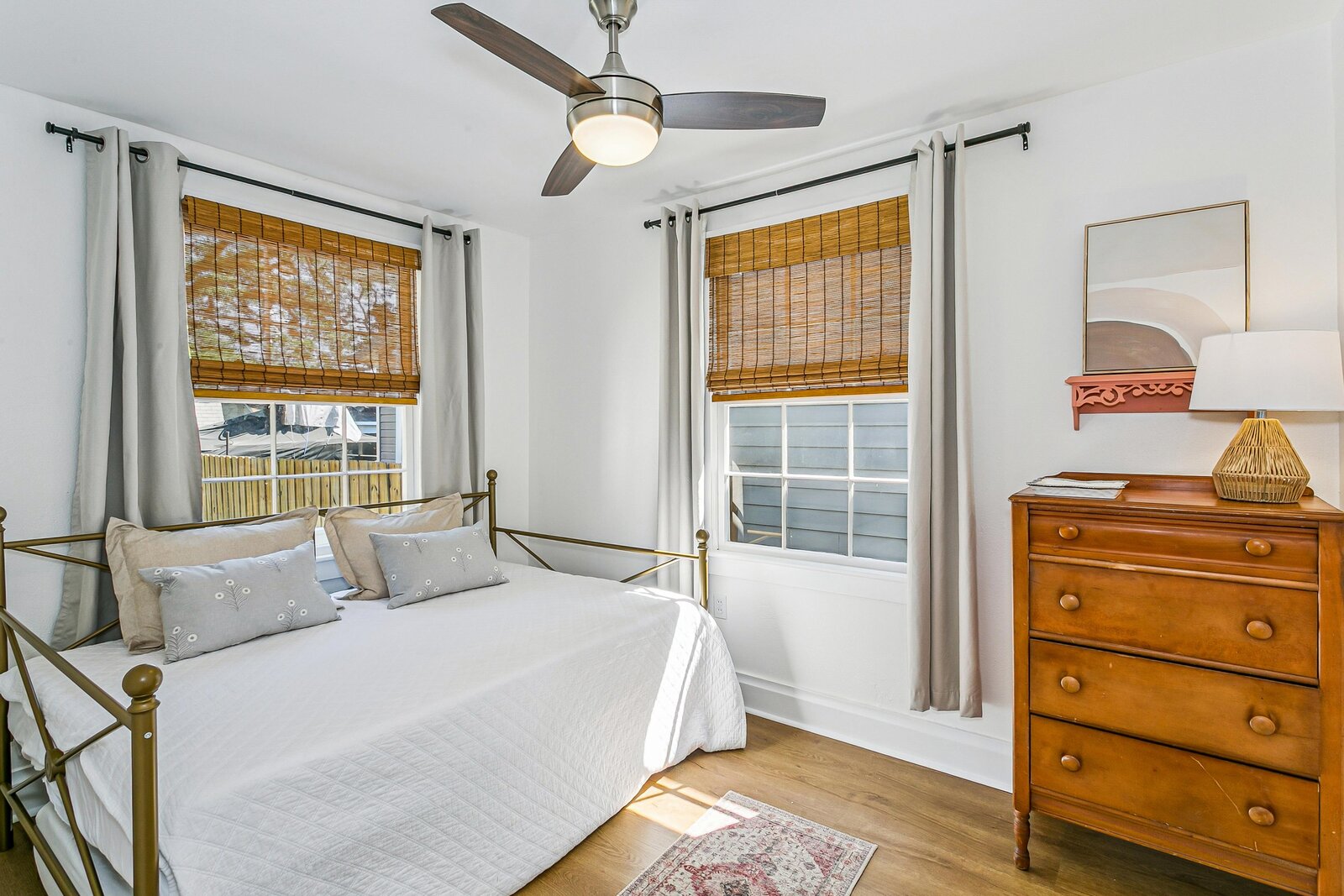 Second bedroom with daybed and vintage dresser
